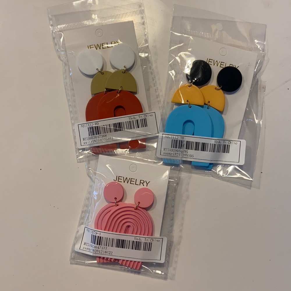 Three pairs of oversized drop earrings